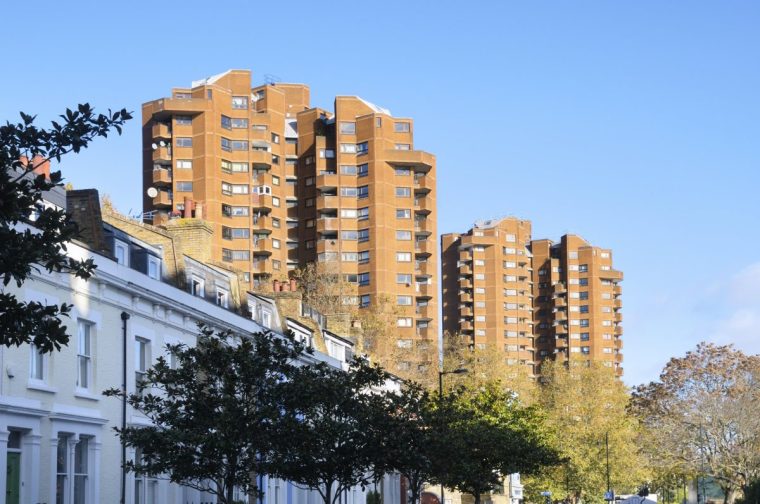 Two Brutalist red brick tower blocks on the World's End Estate, a large 1970s council housing estate in Chelsea, one of London's wealthiest boroughs. England, UK . (Photo by: Chris Harris/UCG/Universal Images Group via Getty Images)