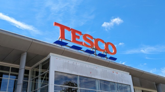 Shepton Mallet, England - 06202024: Tesco supermarket sign against blue sky, multinational groceries and general merchandise retailer in the UK; Shutterstock ID 2493183373; purchase_order: -; job: -; client: -; other: