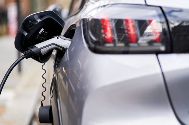 File photo dated 05/03/21 of an electric car plugged into a EV charging point. March was the best month ever for electric car registrations, with demand surging while fuel prices have continued to rise, new data shows. Issue date: Tuesday April 7, 2026. PA Photo. Electrified vehicles accounted for 196,059 registrations last month, the Society of Motor Manufacturers and Traders (SMMT) said. Battery electric car registrations totalled 86,120 in March, a jump of 24.2% compared with the same month last year and a new record high. Furthermore, plug-in hybrid registrations soared by 46.9% year-on-year, while hybrid electric vehicles increased by 7.3%. It comes in the context of soaring oil and gas prices pushing up the cost of fuel, on the back of the conflict in the Middle East. Photo credit should read: John Walton/PA Wire