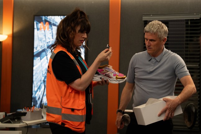 Kerry speaks to Caleb in the depot office in Emmerdale