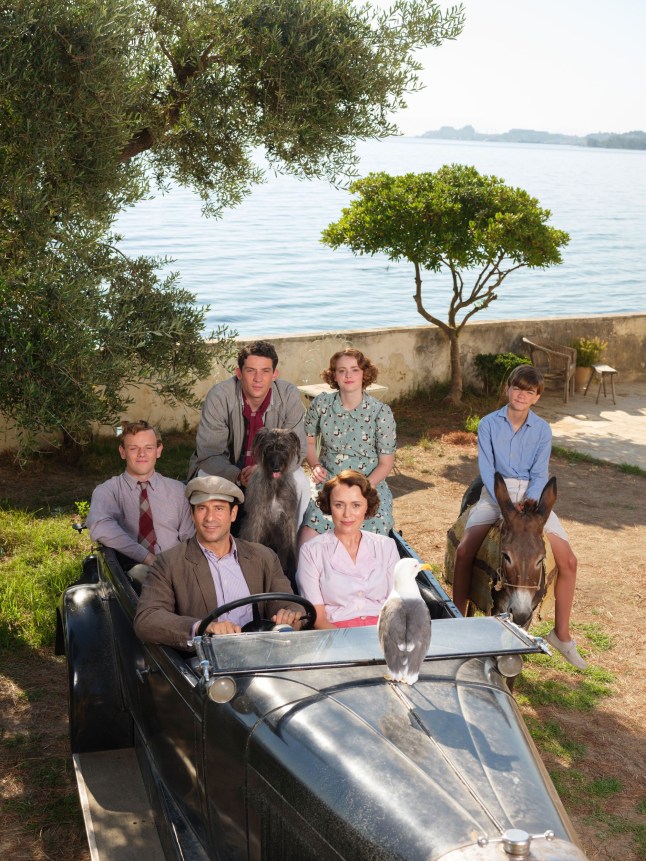 A still from The Durrells with Callum Woodlouse as Leslie Durrell, Josh O'Connor as Larry Durrell, Daisy Waterstone as Margo Durrell, Milo Parker as Gerry Durrell, Alexis Georgoulis as Spiro Hakaiopulos, Keeley Hawes as Louisa Durrell and Roger the Dog.