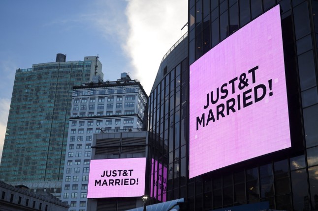 Screens display messages referencing singer Taylor Swift and National Football League (NFL) player Travis Kelce outside Madison Square Garden, the venue for their reported wedding celebrations, in New York, U.S., July 3, 2026. REUTERS/Carlos Barria