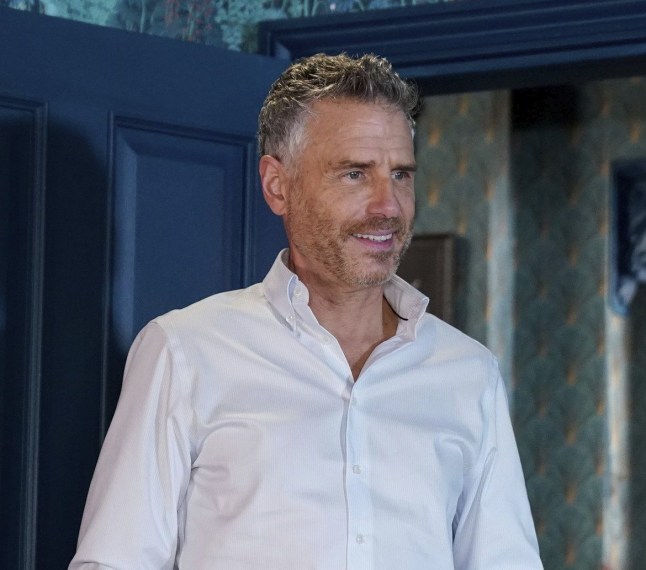 Clive stood in Peacock Palace in EastEnders