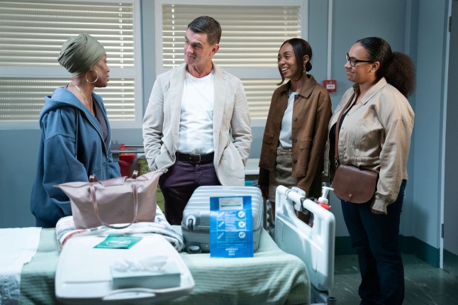Denise, Chelsea and Libby Fox and Jack Branning in a hospital room in EastEnders