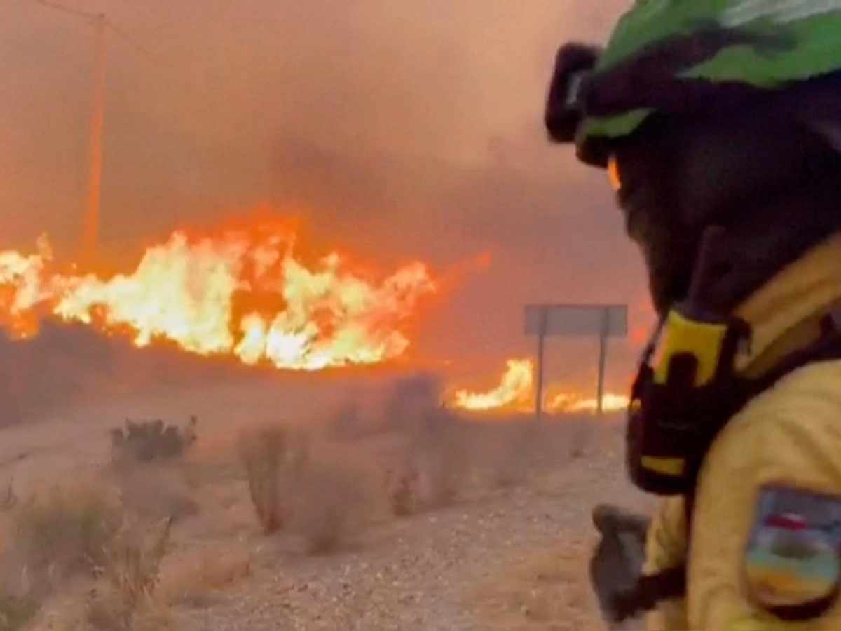 This image made from video provided by INFOCA shows firefighters battling a wildfire near Los Gallardos, Almeria, Spain, on Thursday, July 9, 2026. (INFOCA via AP)
