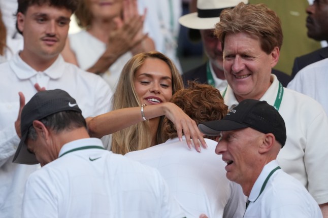 Laila Hasanovic girlfriend of Jannik Sinner of Italy embrace each other after Sinner won the men's singles final defeating Alexander Zverev of Germany, at Wimbledon Tennis Championships in London, Sunday, July 12, 2026. (AP Photo/Kin Cheung)