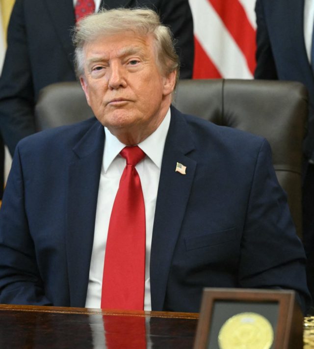 TOPSHOT - US President Donald Trump looks on after signing an executive order to drastically shrink two national monuments in Utah, paving the way for fossil fuel extraction and mining, at the Oval Office of the White House in Washington, DC, on July 13, 2026. The issue has become something of a political football. Previously, President Trump had targeted the two monuments, Bears Ears and Grand Staircase-Escalante, during his first term in 2017, before his Democratic successor, Joe Biden, restored them to their original boundaries in 2021. (Photo by SAUL LOEB / AFP via Getty Images)
