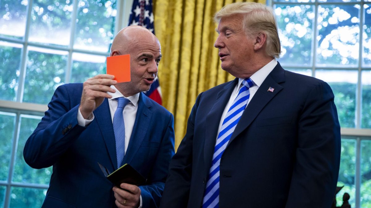 U.S. President Donald Trump, right, is presented a referee red card by Gianni Infantino, president of FIFA, in the Oval Office of the White House in Washington, D.C., U.S., on Tuesday, Aug. 28, 2018. The 2026 FIFA World Cup will be held in the United States, Canada, and Mexico. Photographer: Al Drago/Bloomberg via Getty Images