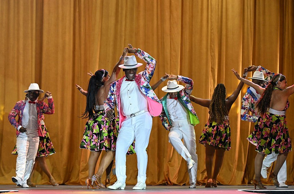 Salsa dancers perform during the 