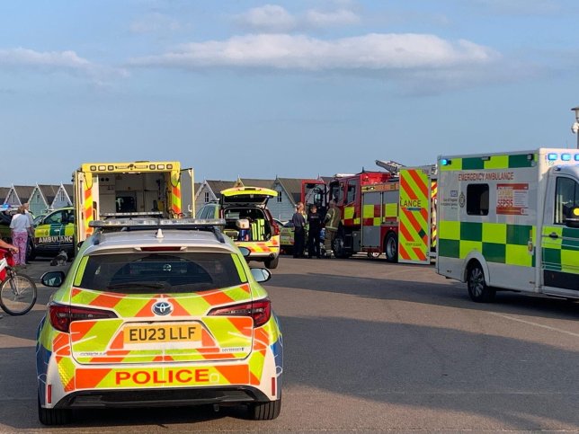 Emergency services on scene after an incident was declared on Mersea Island seafront. // A teenage girl and a woman in her 40s have died after three people got into difficulty in the sea. Emergency services raced to the scene at West Mersea, Essex, at around 5.35pm on Wednesday (July 22) after the alarm was raised by the ambulance service. Despite the efforts by rescuers, the teenage girl and the woman died at the scene. A third person remains in hospital in a serious condition. Photo released 23/07/2026