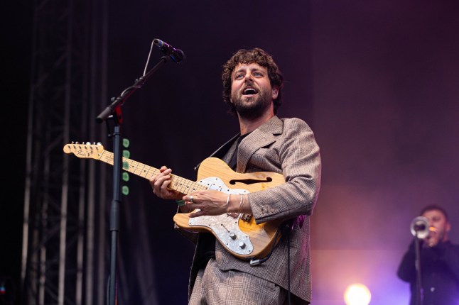 BRISTOL, ENGLAND - JULY 23: Felix White of The Maccabees performs during Siren Bristol at Bristol Amphitheatre on July 23, 2026 in Bristol, England. (Photo by Mike Lewis Photography/Redferns)