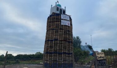 Man arrested after replica of mosque placed on top of loyalist bonfire – The Irish Times