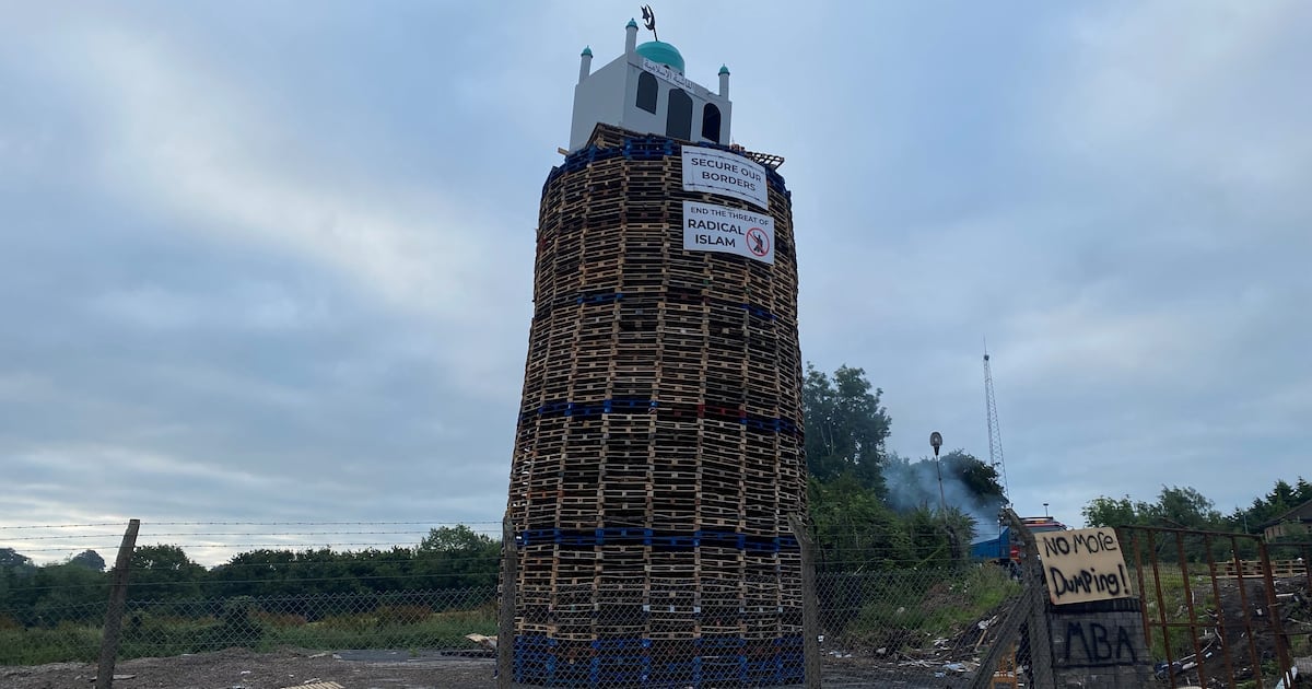 Man arrested after replica of mosque placed on top of loyalist bonfire – The Irish Times