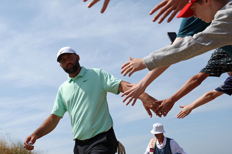 Scottie Scheffler greets fans on day one of the Open at Royal Birkdale. Photograph: Adrian Dennis/AFP via Getty Images
