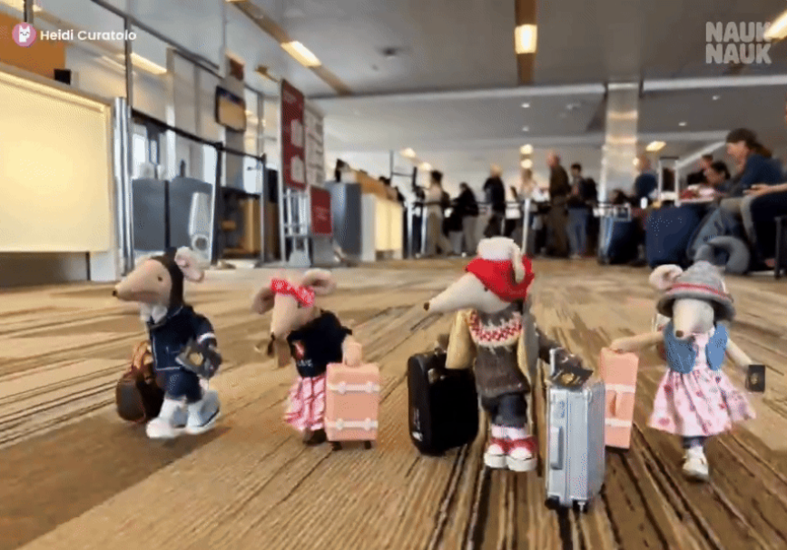 In this still from an AI-generated short made on NaukNauk, Maileg mice, a line of handcrafted Danish miniature stuffed toys, scurry through an airport