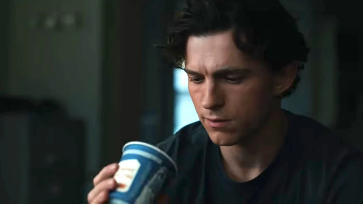 Peter Parker sadly looks at a Greek coffee cup in Spider-man : brand new day