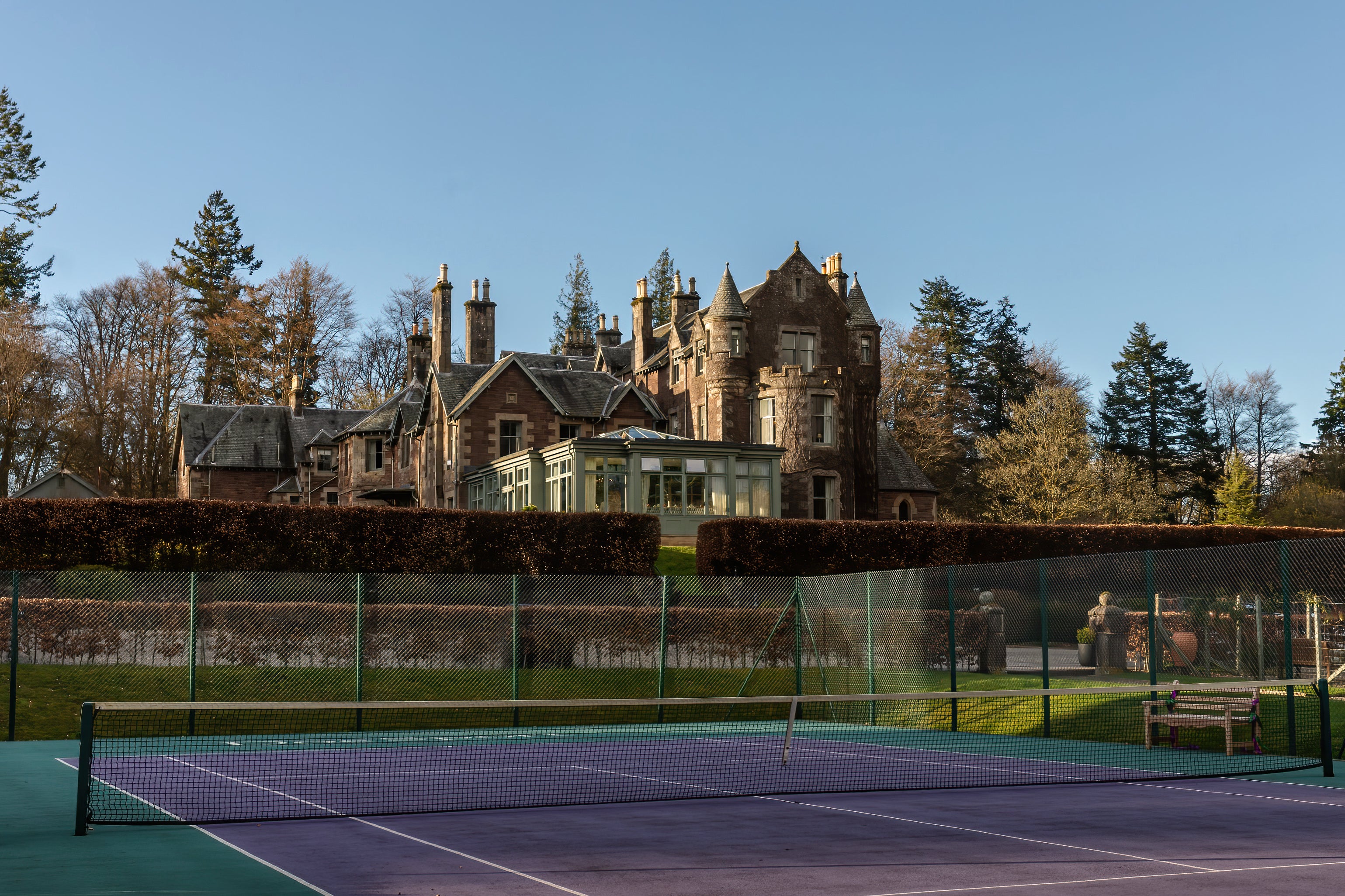 The tennis court at Andy Murray’s Cromlix hotel is Wimbledon green and purple