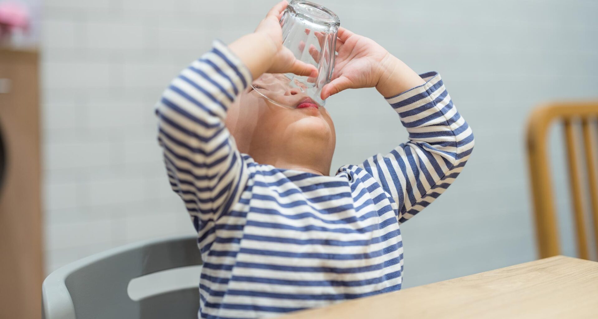 Toddler Boy Finishing Drink