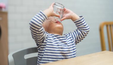 Toddler Boy Finishing Drink