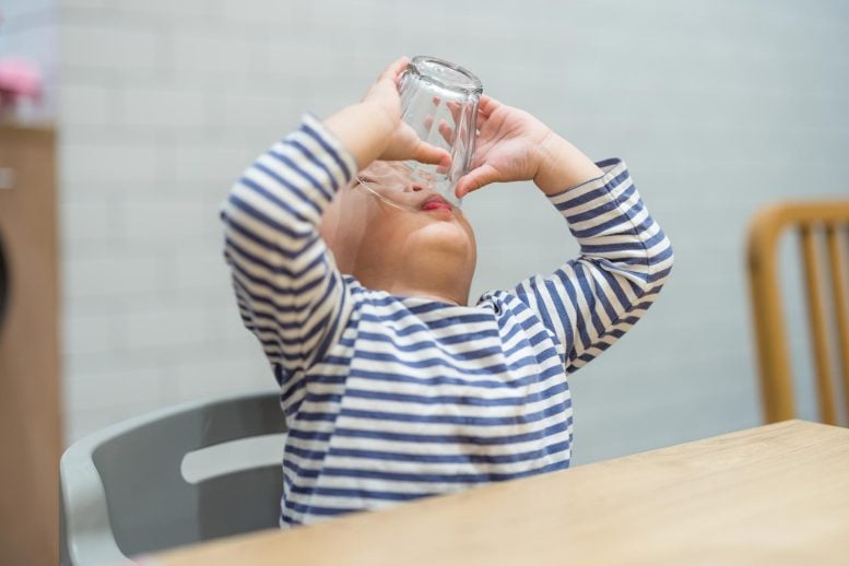 Toddler Boy Finishing Drink