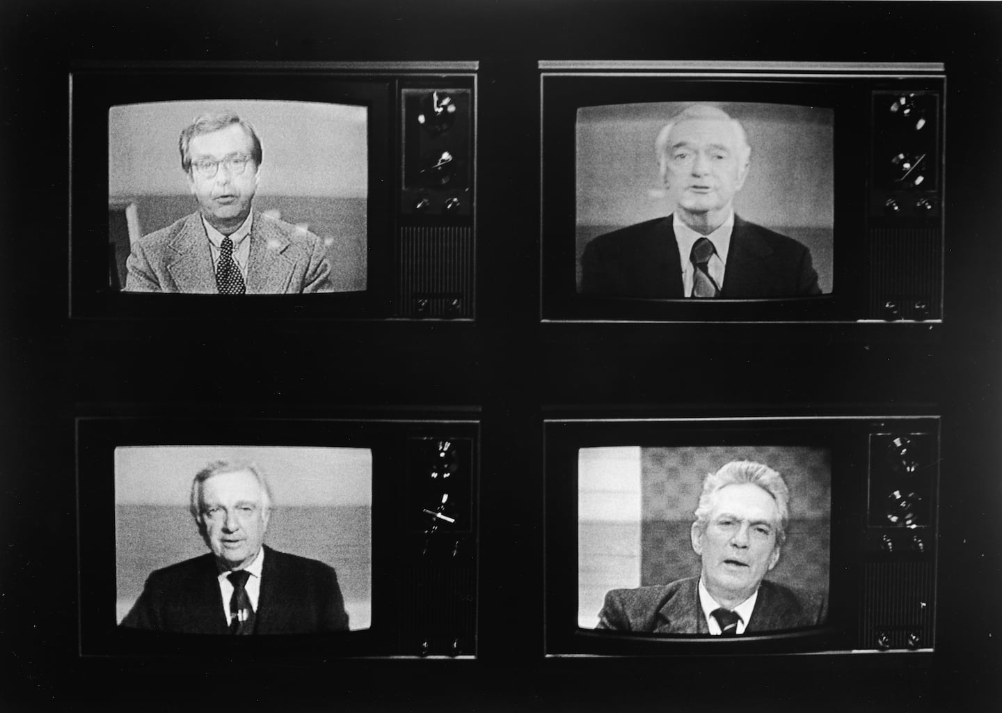 Actor Peter Finch (bottom right) appears on a television screen with television commentators (clockwise from bottom left) Walter Cronkite, John Chancellor, and Howard K. Smith in a still from the 1976 film "Network."