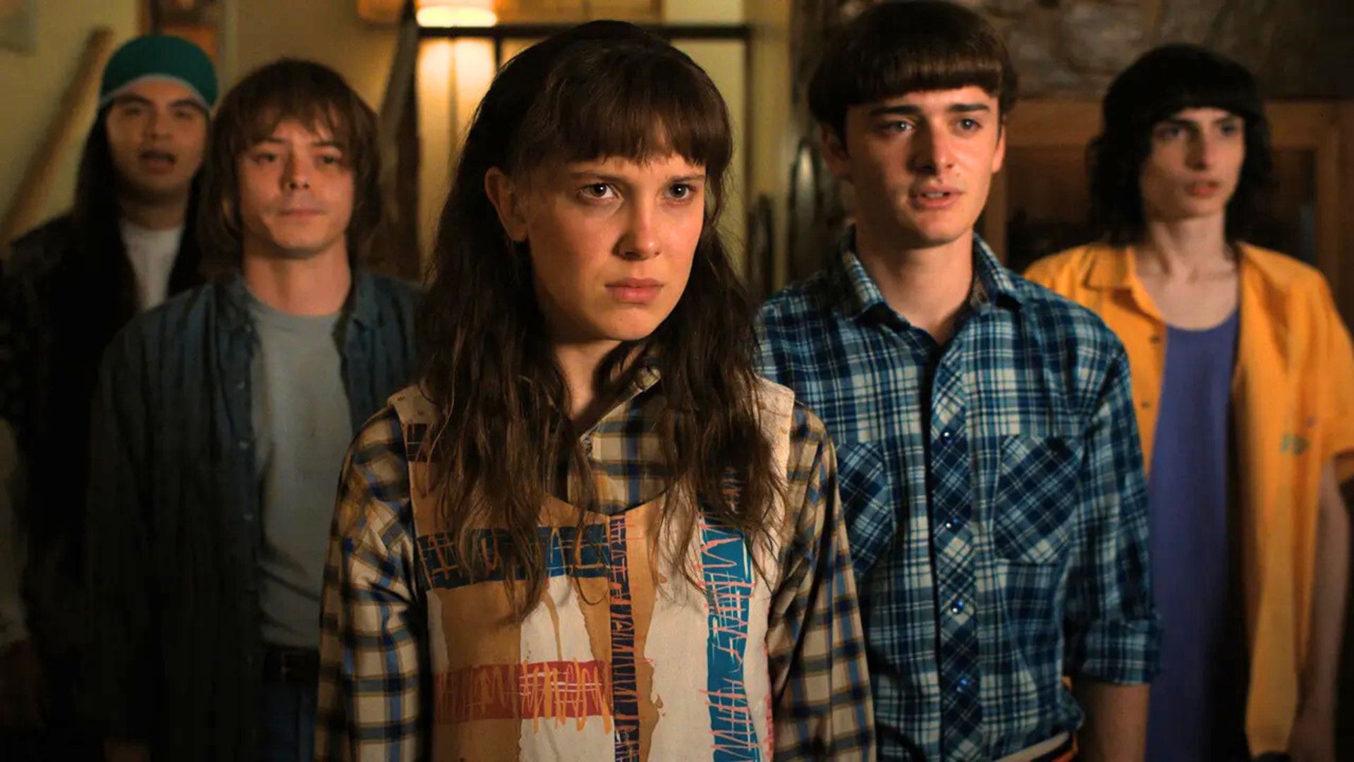 The boys stand behind Eleven, all looking forlorn