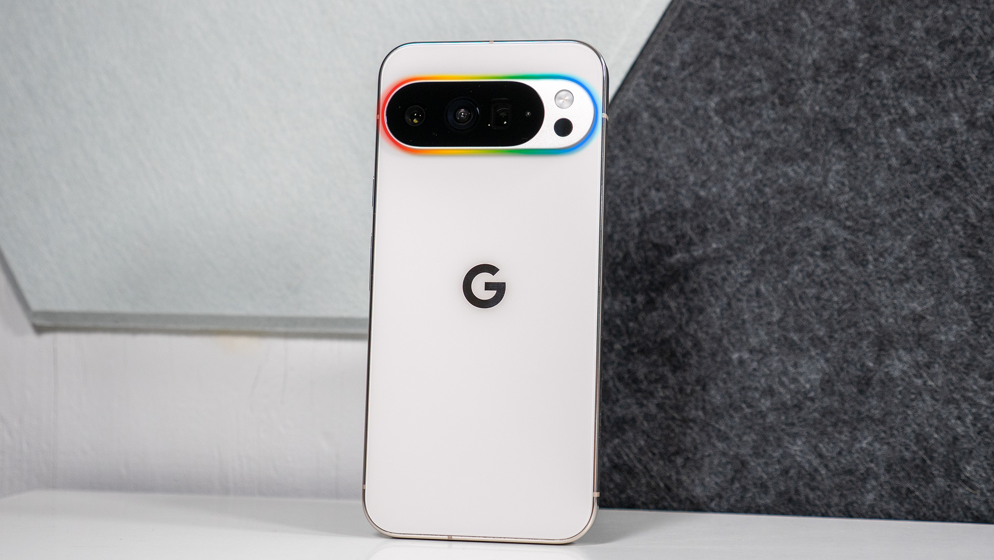 A mockup of a Pixel 11 with a glowing camera island representing the rumored Pixel Glow feature, using a Pixel 10 Pro XL as the model