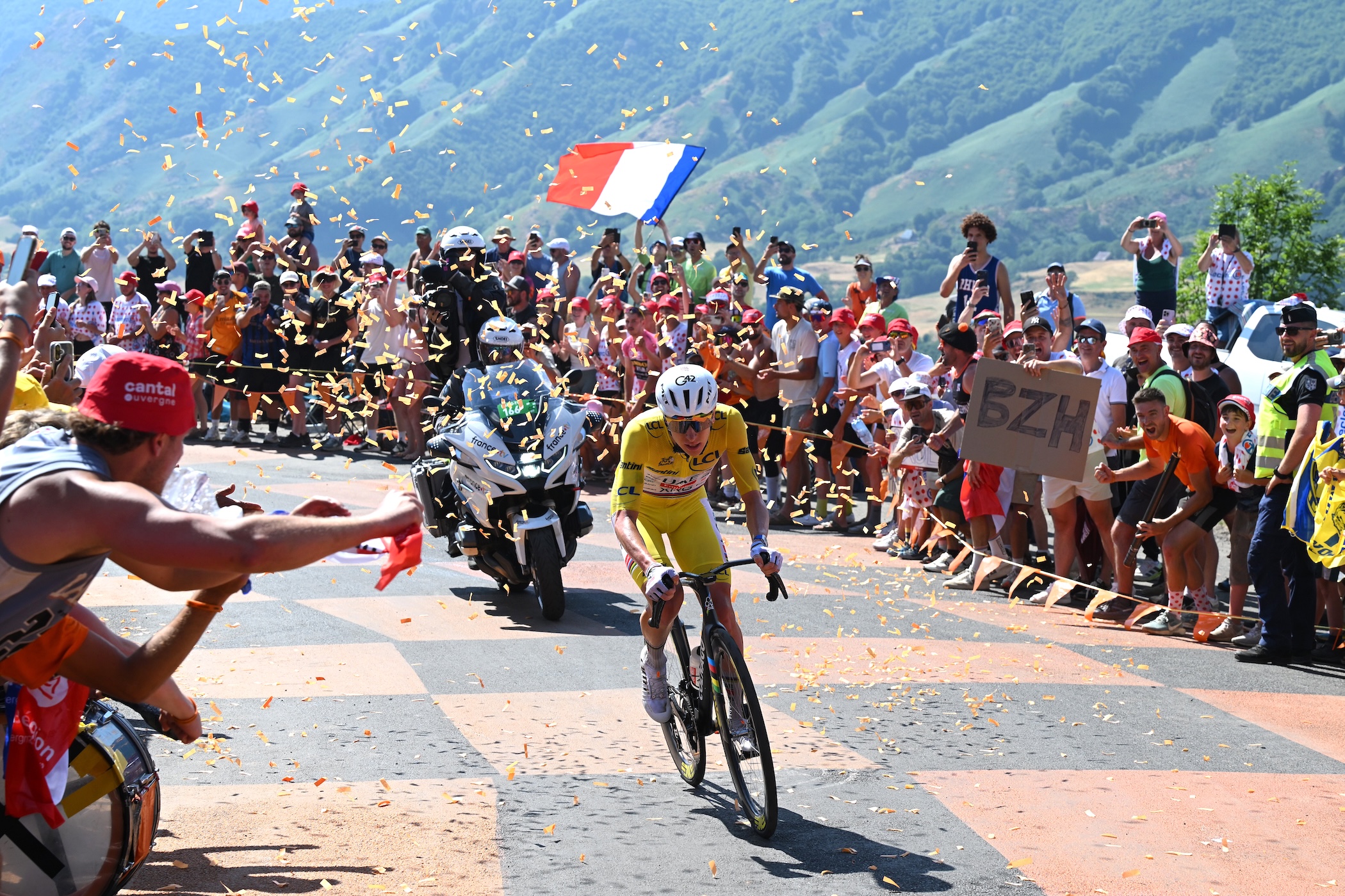 Tadej Pogacar (UAE Team Emirates - XRG) rides at the front of the race solo while fans cheers on stage 10