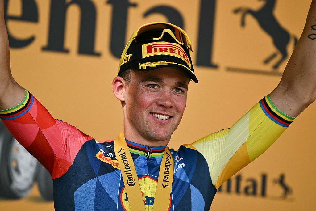 Lidl - Trek team's Danish rider Mads Pedersen celebrates on the podium after winning the 4th stage of the Tour de France