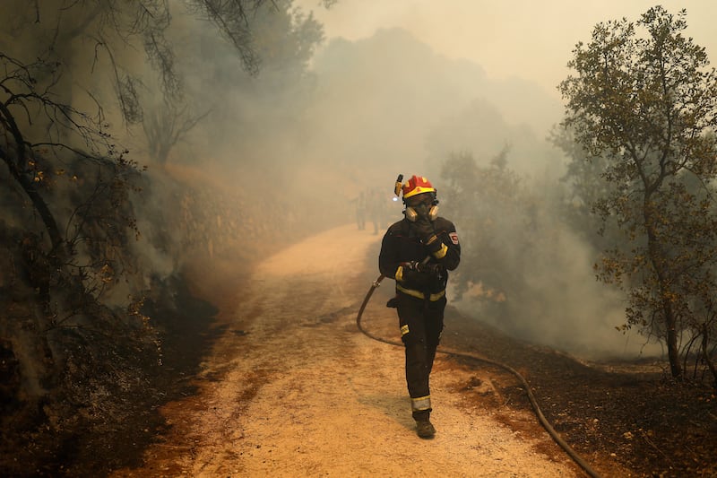 Firefighters battle a wildfire burning near San Martin de Valdeiglesias, about 70km west of Madrid, on Sunday. Photograph: Getty Images
