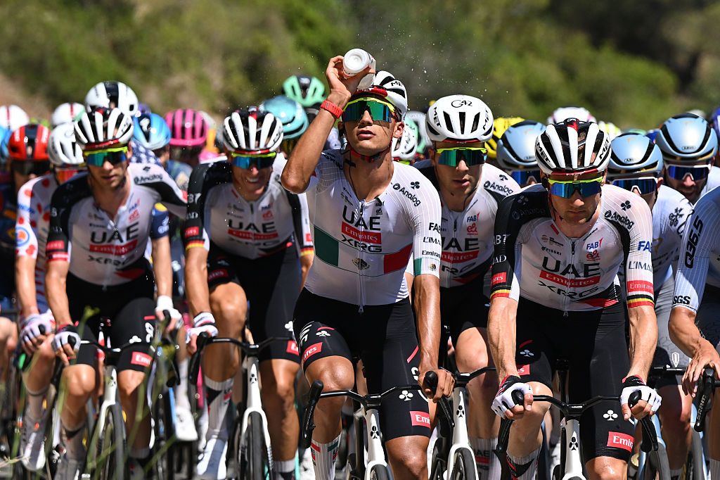 UAE Team Emirates during stage 2 of the Tour de France, Del Toro dousing himself with water