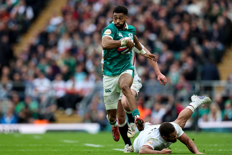 Robert Baloucoune powers past the England defence during Ireland's Six Nations victory at Twickenham in February. Photograph: Billy Stickland/Inpho