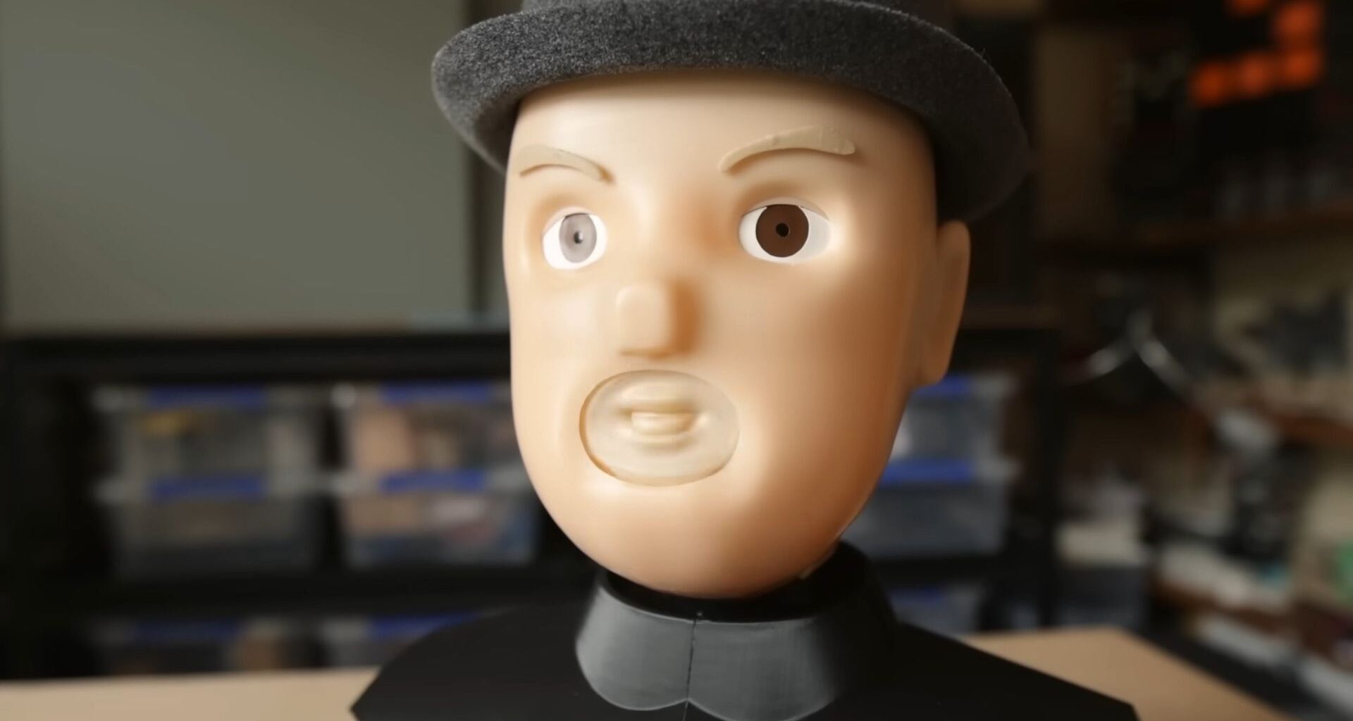 A screenshot from a YouTube video showing a lip-syncing robot