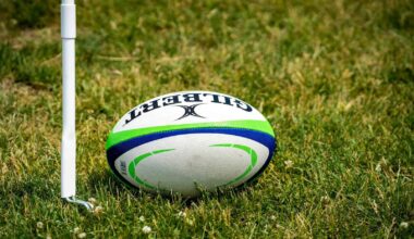 a rugby ball sitting on top of a lush green field