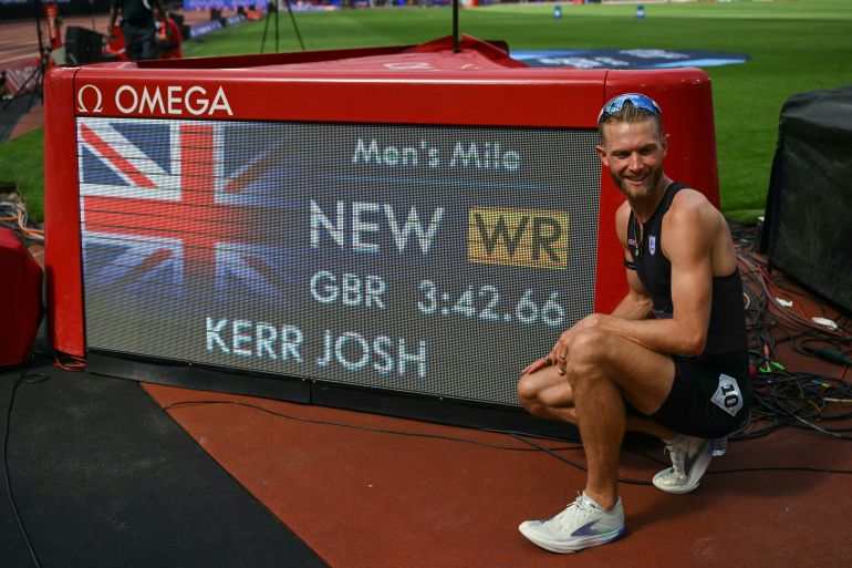 Britain's Josh Kerr poses next to the world record time after winning the men's one mile event during the IAAF Diamond League athletics competition at the London stadium in London on July 18, 2026. (Photo by Glyn KIRK / AFP)