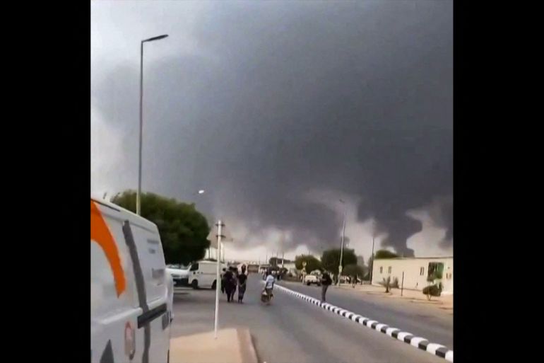 This screen grab taken on July 25, 2026 from an undated UGC video footage posted on social media and verified by AFPTV teams shows clouds of smoke rising after strikes on the Saudi Aramco refinery in Jizan.
