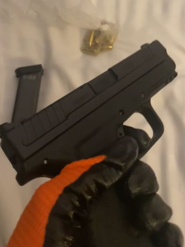 Undated handout file photo originally issued on June 5 by the Metropolitan Police of Natland wearing gloves whilst handling a gun.