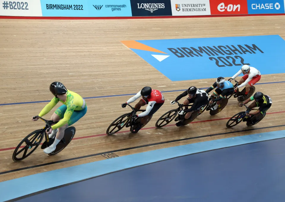Australia's Thomas Cornish (in yellow and green), Trinidad and Tobago's Nicholas Paul (in red and white), New Zealand's Sam Webster (in black), India's David Beckham (in light blue and black), England's Hayden Norris (in white and red) and Jamaica's Malik Reid (in black, green and yellow) compete in the men's keirin first round cycling event at the 2022 Commonwealth Games