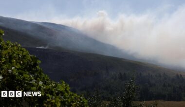 Smoke from a moorland blaze rises near the Dovestone Reservoir.