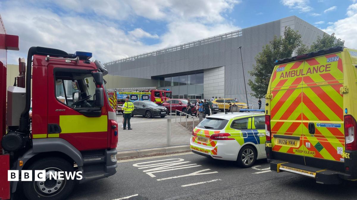 Police fire and ambulance service vehicles parked outside