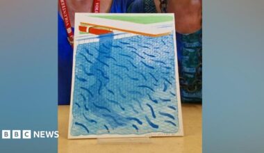 A colourful blue print of a swimming pool, with a faint pencilled signature of David Hockney in the bottom right hand side