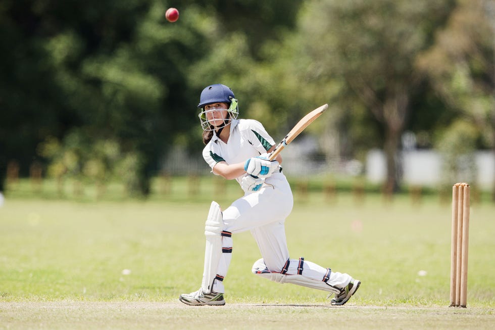 Girl playing cricket a girl batting as she plays in a cricket match