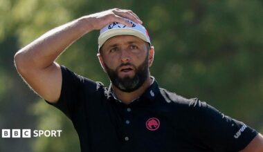 Jon Rahm has his hand on his head