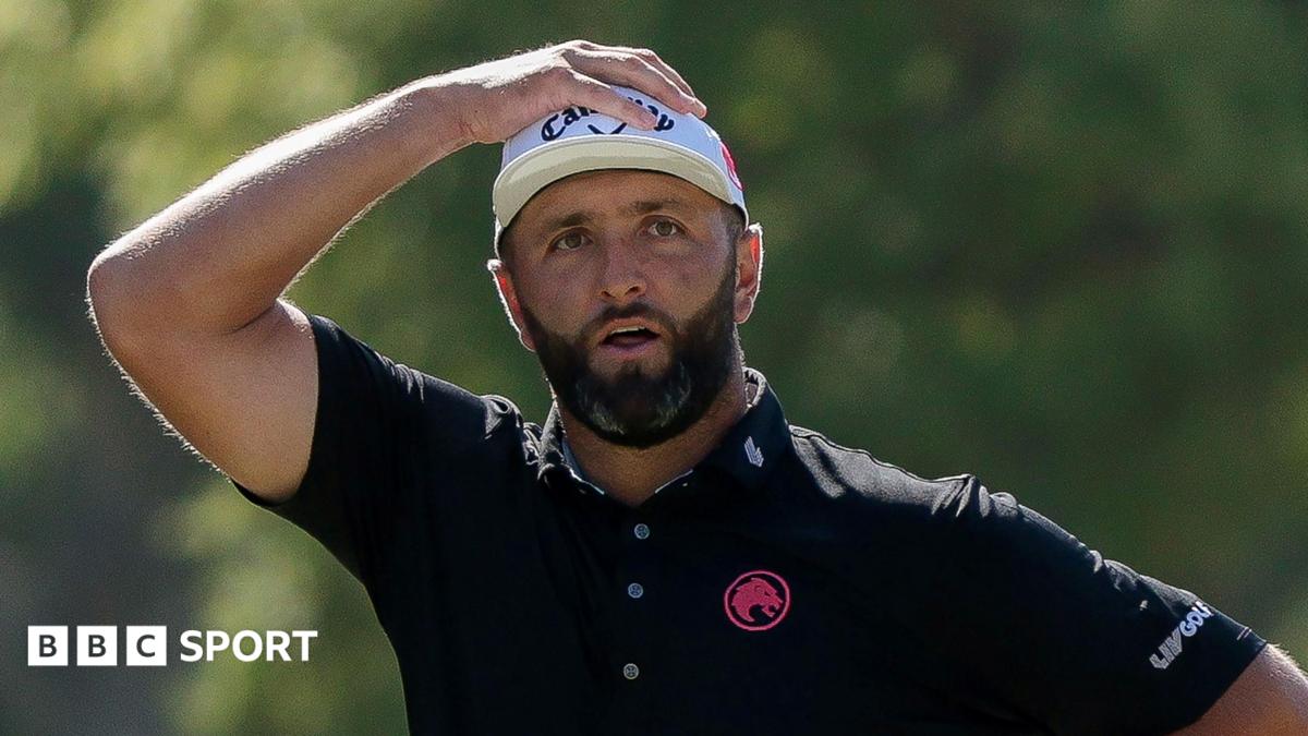 Jon Rahm has his hand on his head