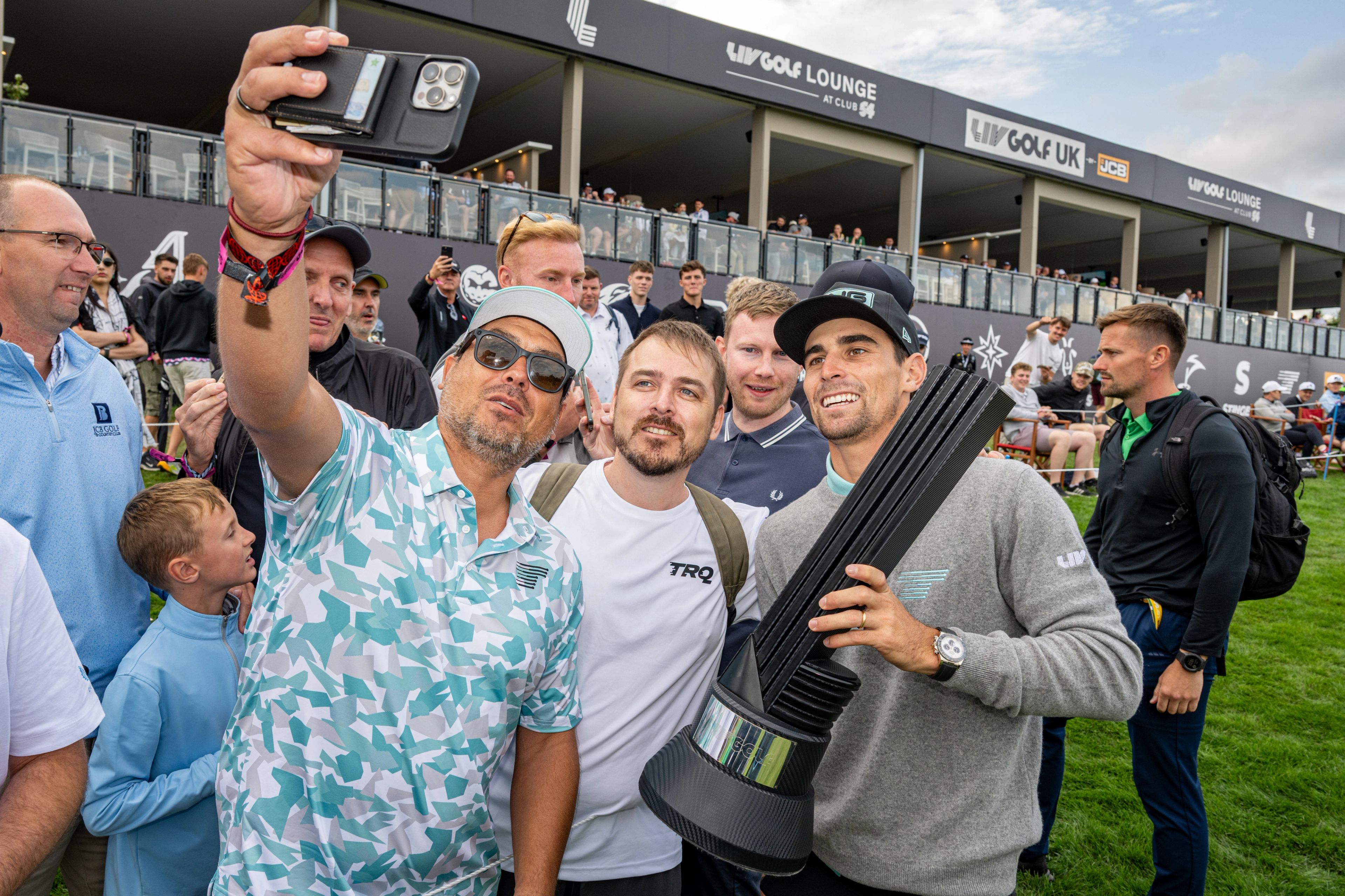 Joaquin Niemann poses with fans after winning the individual title at LIV Golf United Kingdom presented by JCB in 2025.