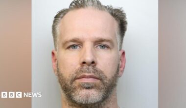 A custody image of Craig Hurcombe. He has stubble and a moustache, and a blank expression, looking at the camera