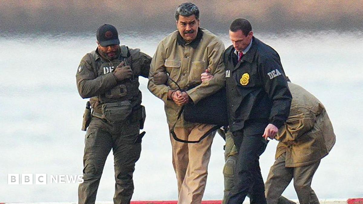 Nicolas Maduro is seen in handcuffs after landing at a Manhattan helipad, escorted by heavily armed Federal agents as they make their way into an armored car en route to a Federal courthouse in Manhattan on 5 January 2026 in New York City.