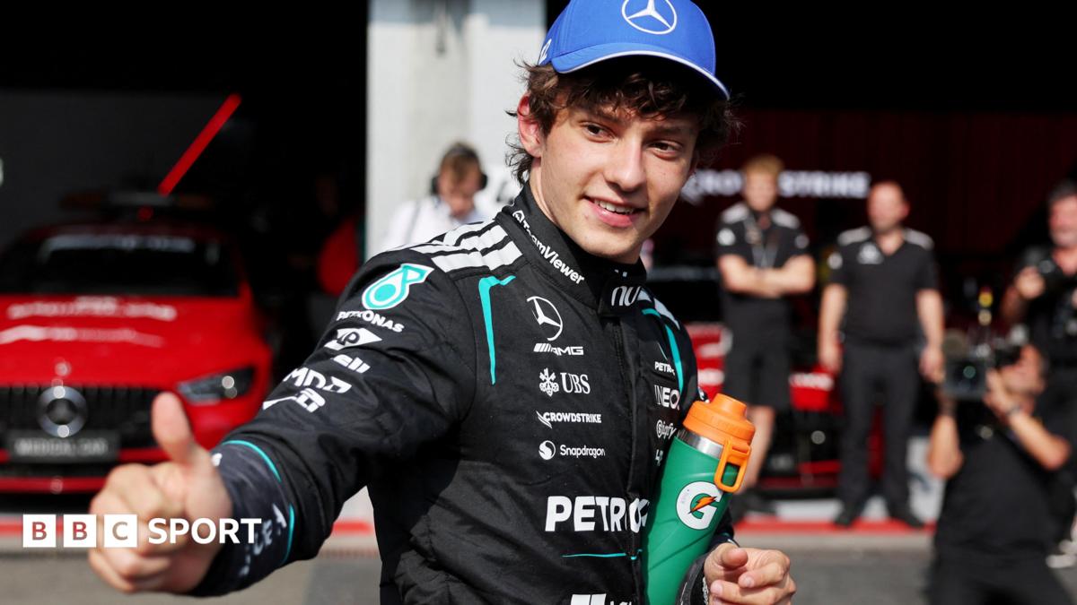 Mercedes' Kimi Antonelli gives the thumbs-up signal in the pit lane after taking pole position for the Belgian Grand Prix