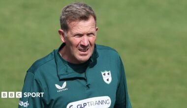 Alan Richardson wearing a green Worcestershire training top looks on