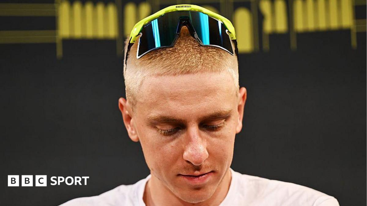 Tadej Pogacar looks downwards as he sports a close-cropped blond hairstyle